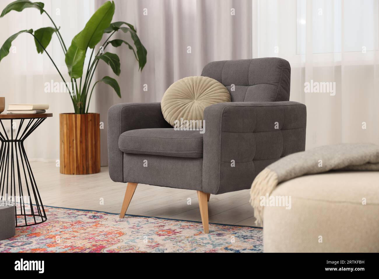 Stylish gray armchair in living room. Interior design Stock Photo Alamy