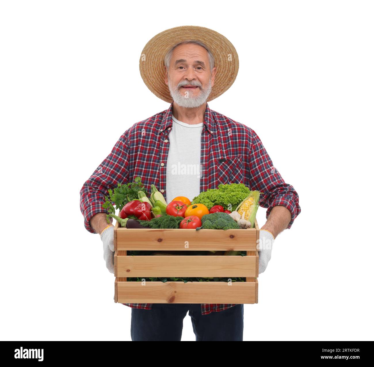 Harvesting season. Happy farmer holding wooden crate with vegetables on ...