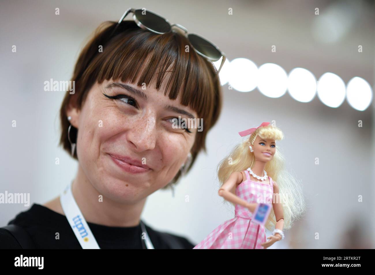New York, USA. 13th Sep, 2023. Abigail Moise from France holds a Barbie doll while attending the TTPM (Toy, Tots, Pets & More) holiday exhibition held at the Metropolitan Pavilion, New York, NY, September 13, 2023. The exhibition displays toys for interactive play from both large and smaller toy manufactures. (Photo by Anthony Behar/Sipa USA) Credit: Sipa USA/Alamy Live News Stock Photo