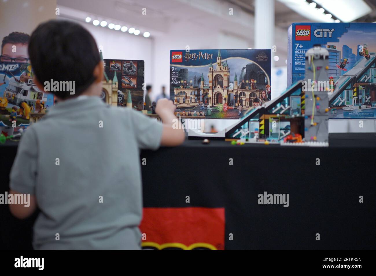 New York, USA. 13th Sep, 2023. A young boy plays with Legos at the TTPM (Toy, Tots, Pets & More) holiday exhibition held at the Metropolitan Pavilion, New York, NY, September 13, 2023. The exhibition displays toys for interactive play from both large and smaller toy manufactures. (Photo by Anthony Behar/Sipa USA) Credit: Sipa USA/Alamy Live News Stock Photo