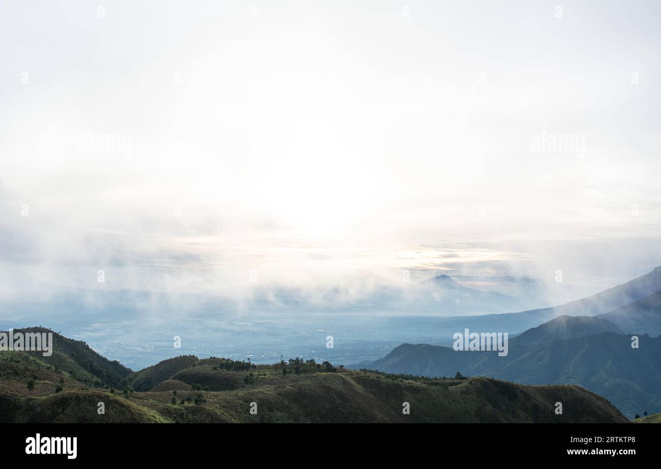 Morning view of foggy hills at the top of Mount Prau Stock Photo - Alamy