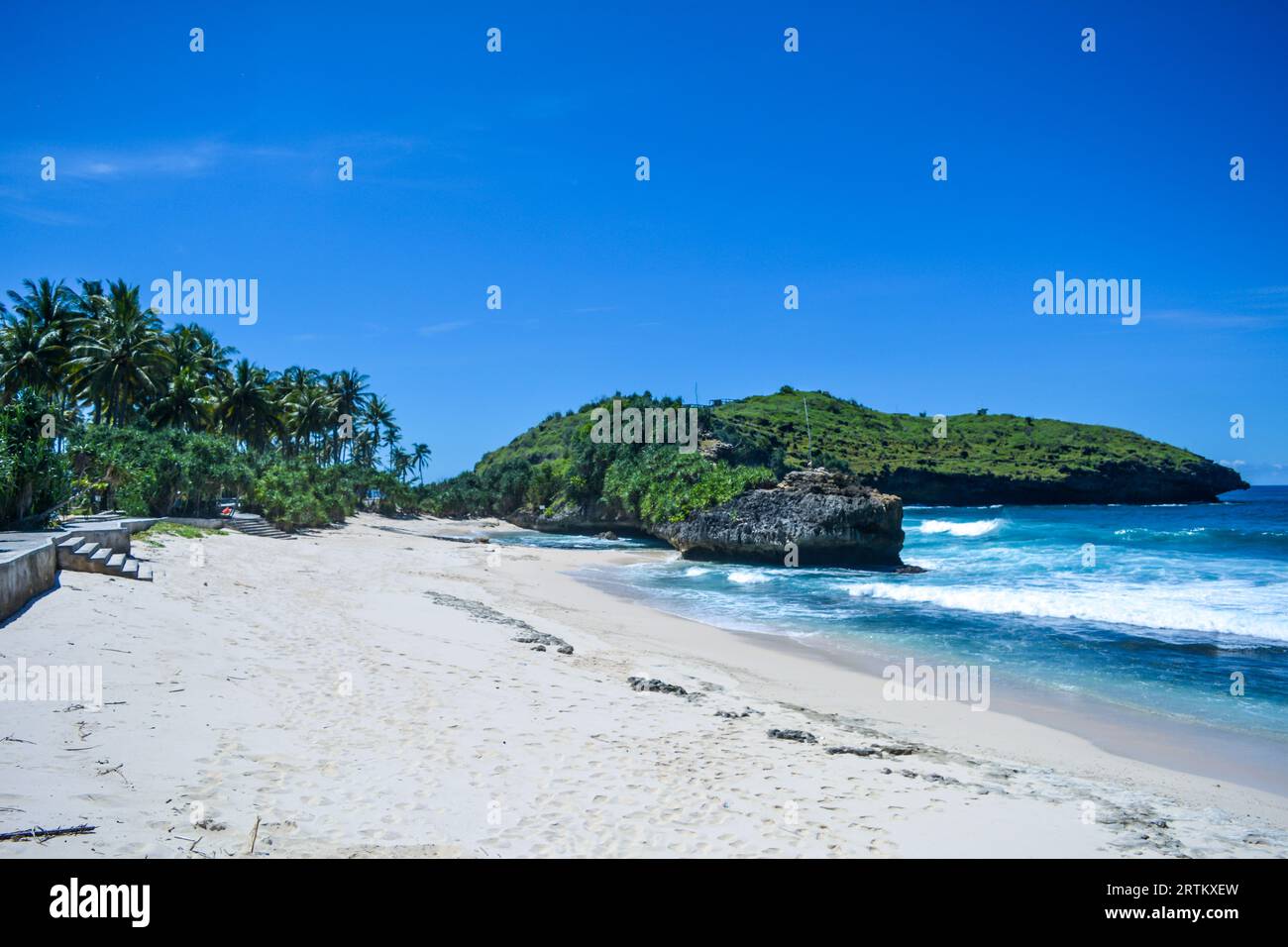 The beautiful view of Srau beach in Pacitan Indonesia, white sand and there are several fishing boats looking for lobster Stock Photo