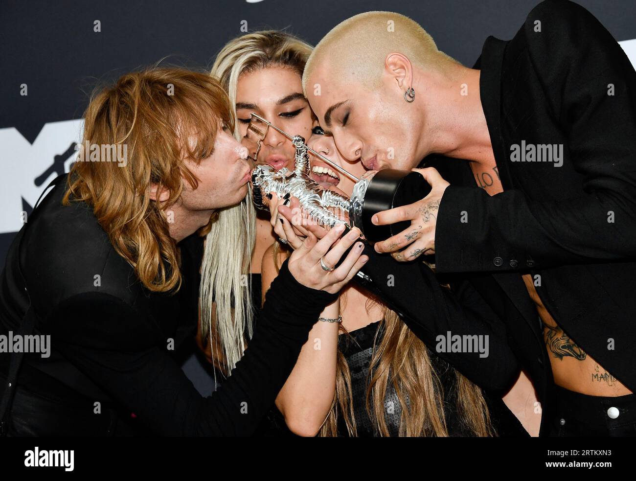 Måneskin band members Thomas Raggi, left, Ethan Torchio, Victoria De ...