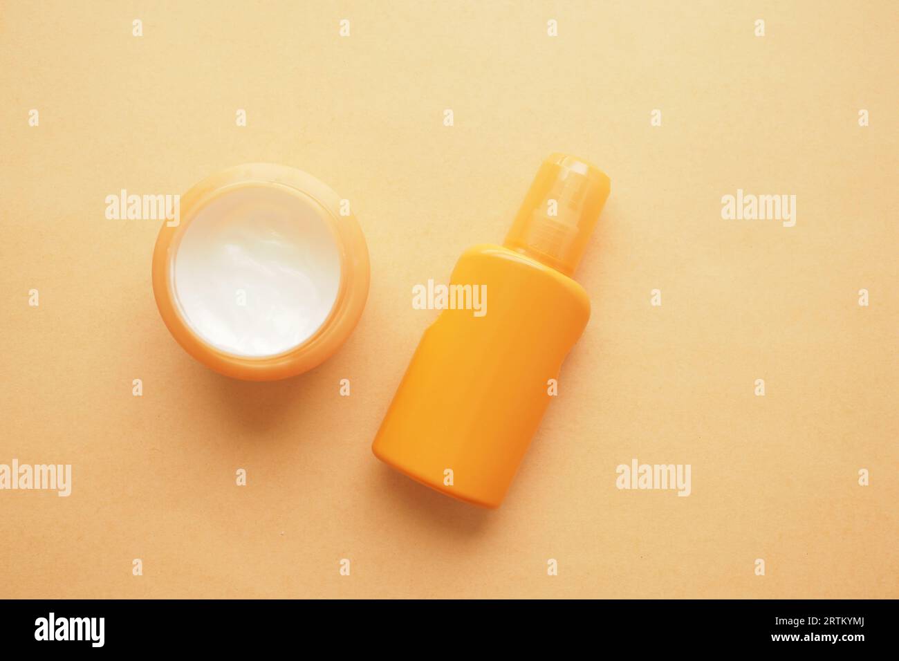 top view of sunscreen cream on a orange color background Stock Photo ...