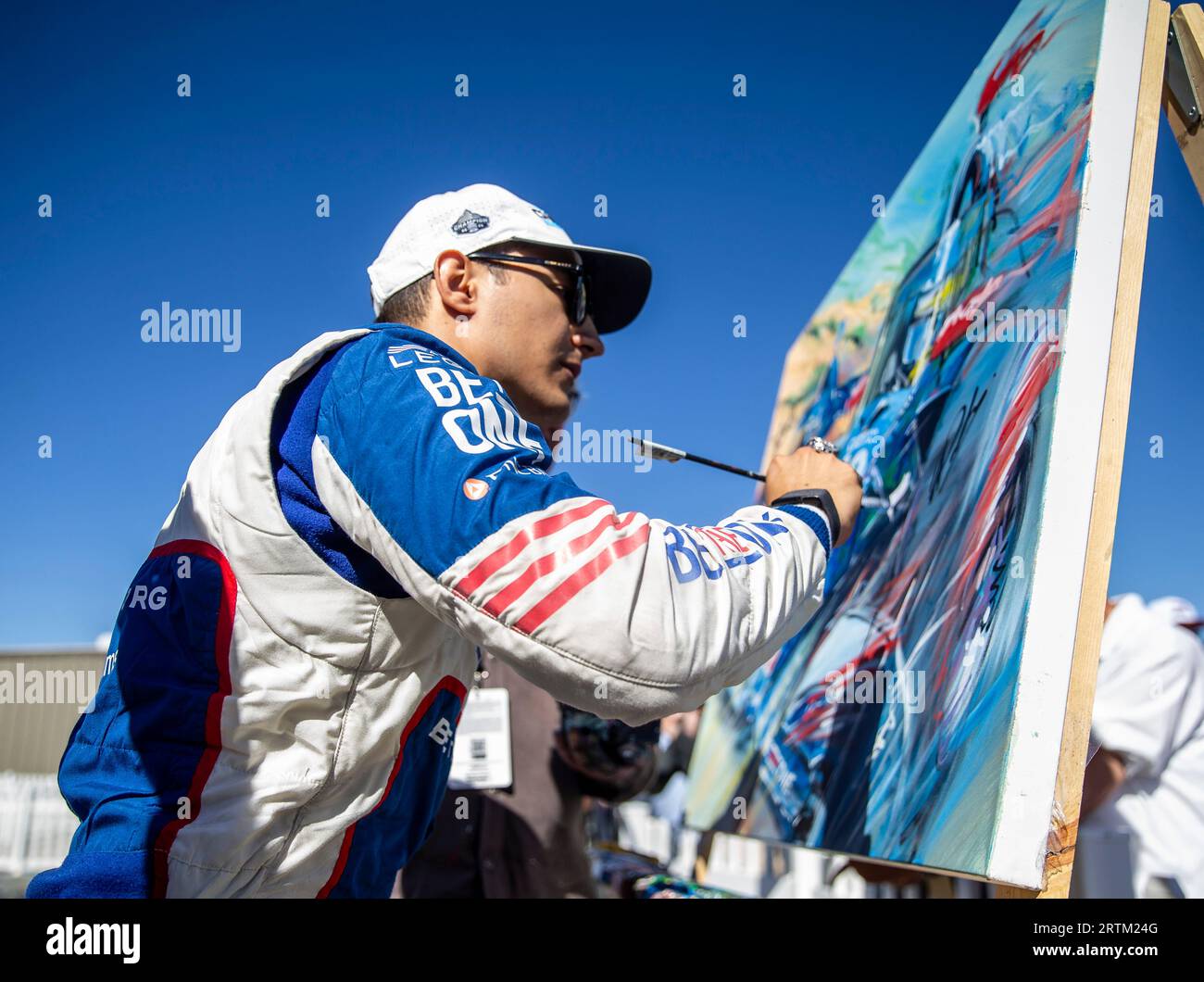 September 10 2023 Monterey, CA, U.S.A. Driver Ãlex Palou (10) sign an autograph painting after the Firestone Grand Prix of Monterey NTT Indycar Championship. Alex Palou takes third place and was crowned the NTT Indycar champion at Weathertech Raceway Laguna Seca Monterey, CA Thurman James/CSM (Credit Image: © Thurman James/Cal Sport Media) Stock Photo