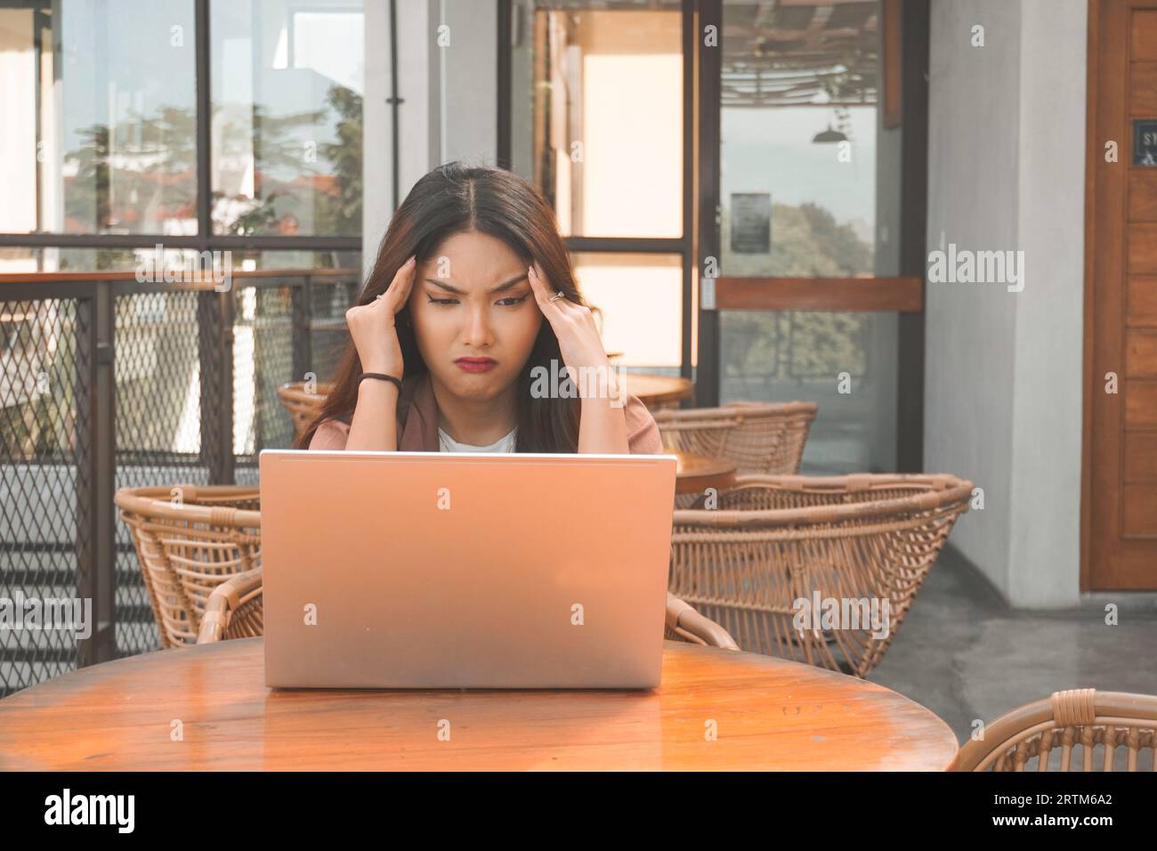 Asian attractive old business man and young business woman worry, sad,  headache, feel blue and disappointed after they make a mistake in  responsible project Stock Photo