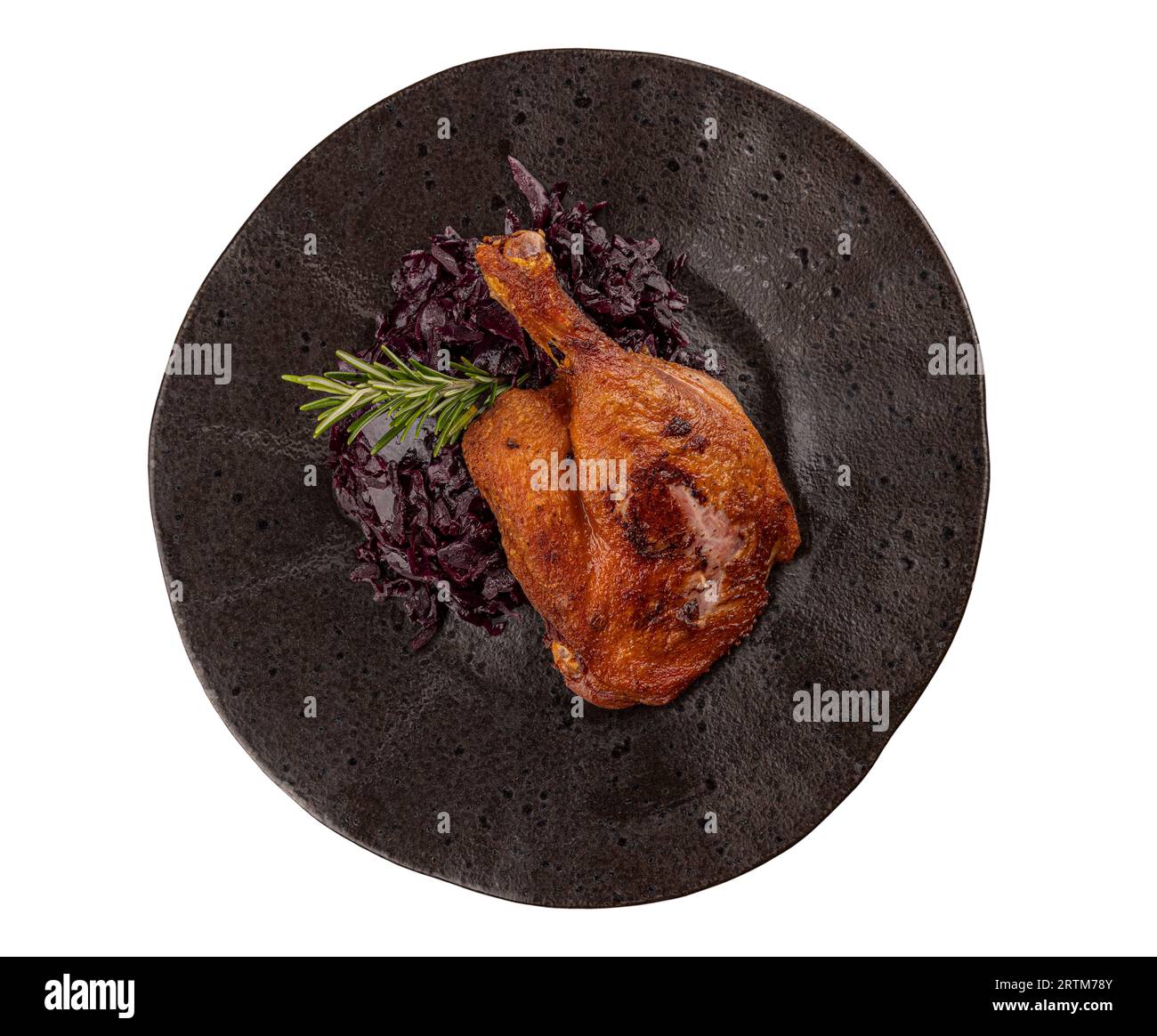 Portion of roast duck leg served with red cabbage Stock Photo - Alamy