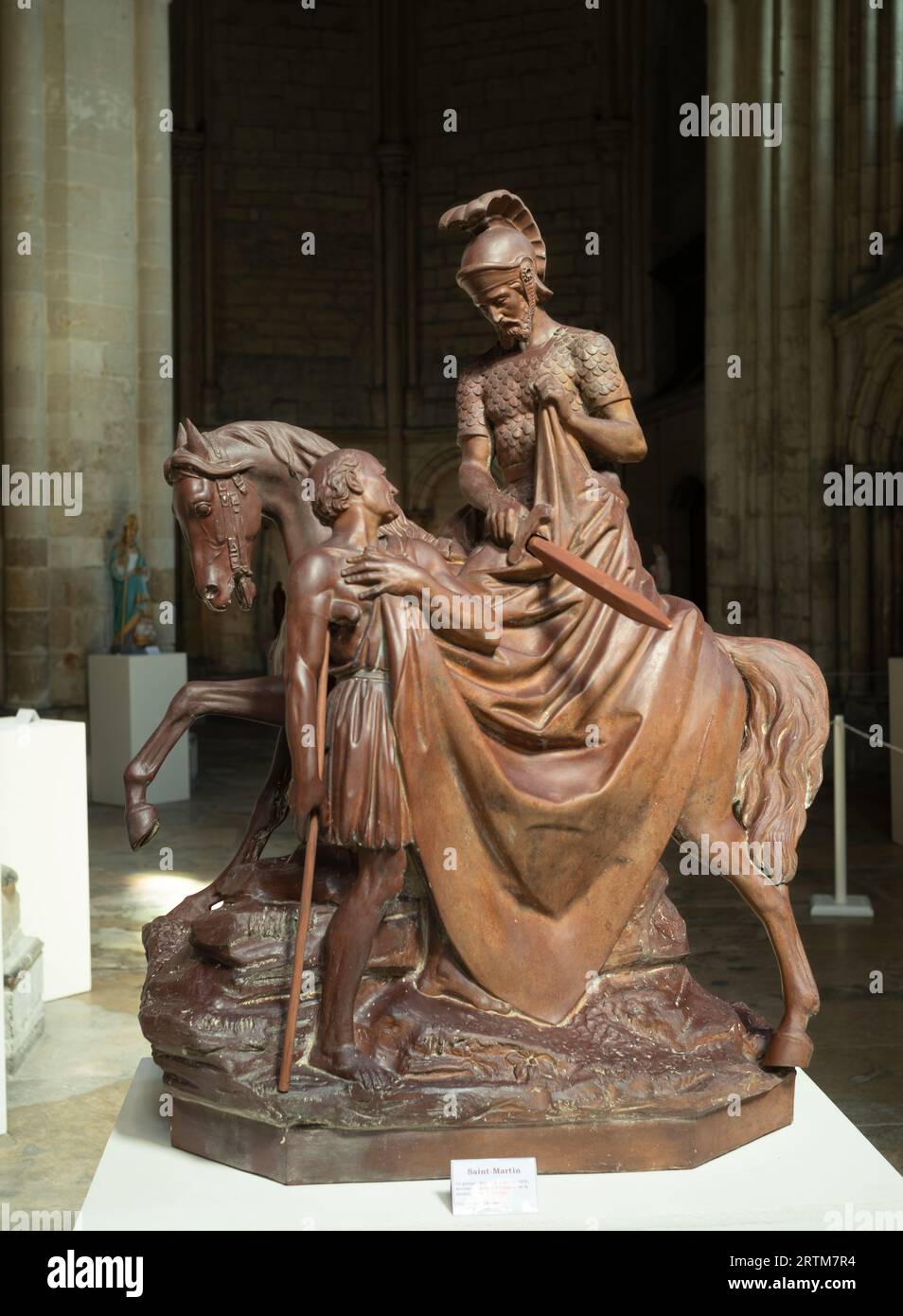 Helping Statue A statue of St Martin on horseback helping a beggar in the catholic ...