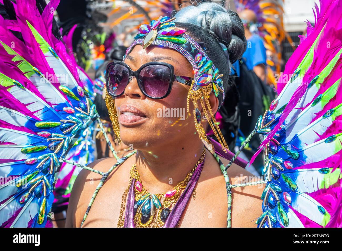 NOTTING HILL, LONDON, ENGLAND - 28 August 2023: Woman wearing a costume at Notting Hill Carnival 2023 Stock Photo