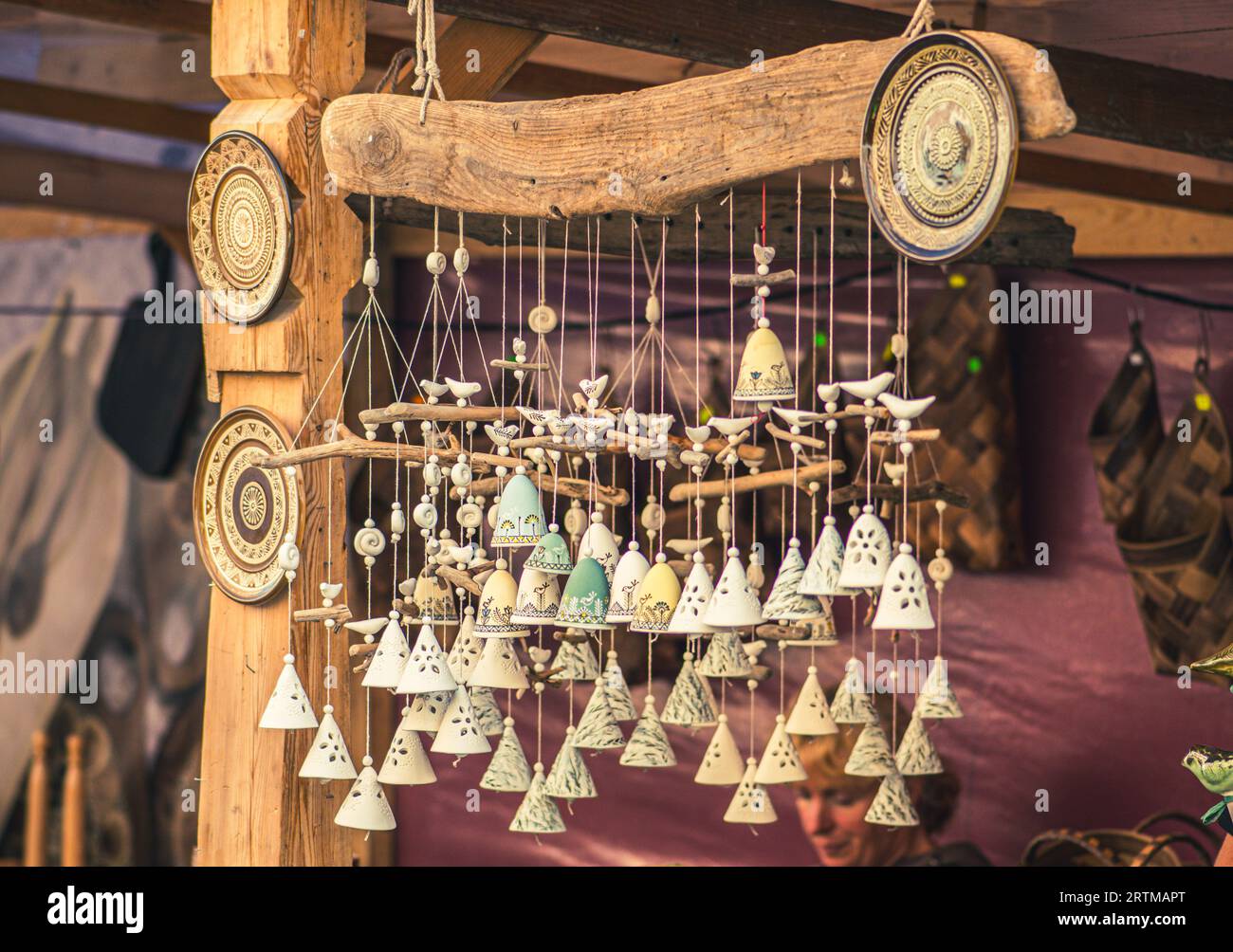 Cute ceramic traditional bells in a folk arts and crafts fair or market in Vilnius, Lithuania, Europe Stock Photo