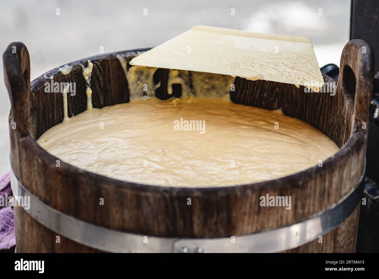 Initial stage of preparation of a tree cake, Lithuanian šakotis, Polish sękacz, Belarusian bankucha, German baumkuchen made of butter, egg whites Stock Photo