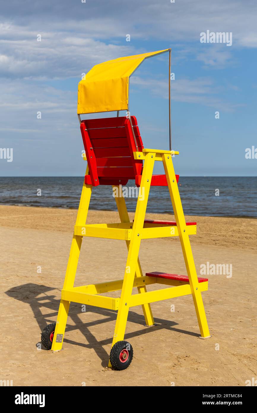 Empty lifeguard chair on the sea beach. Lifeguard equipment to support