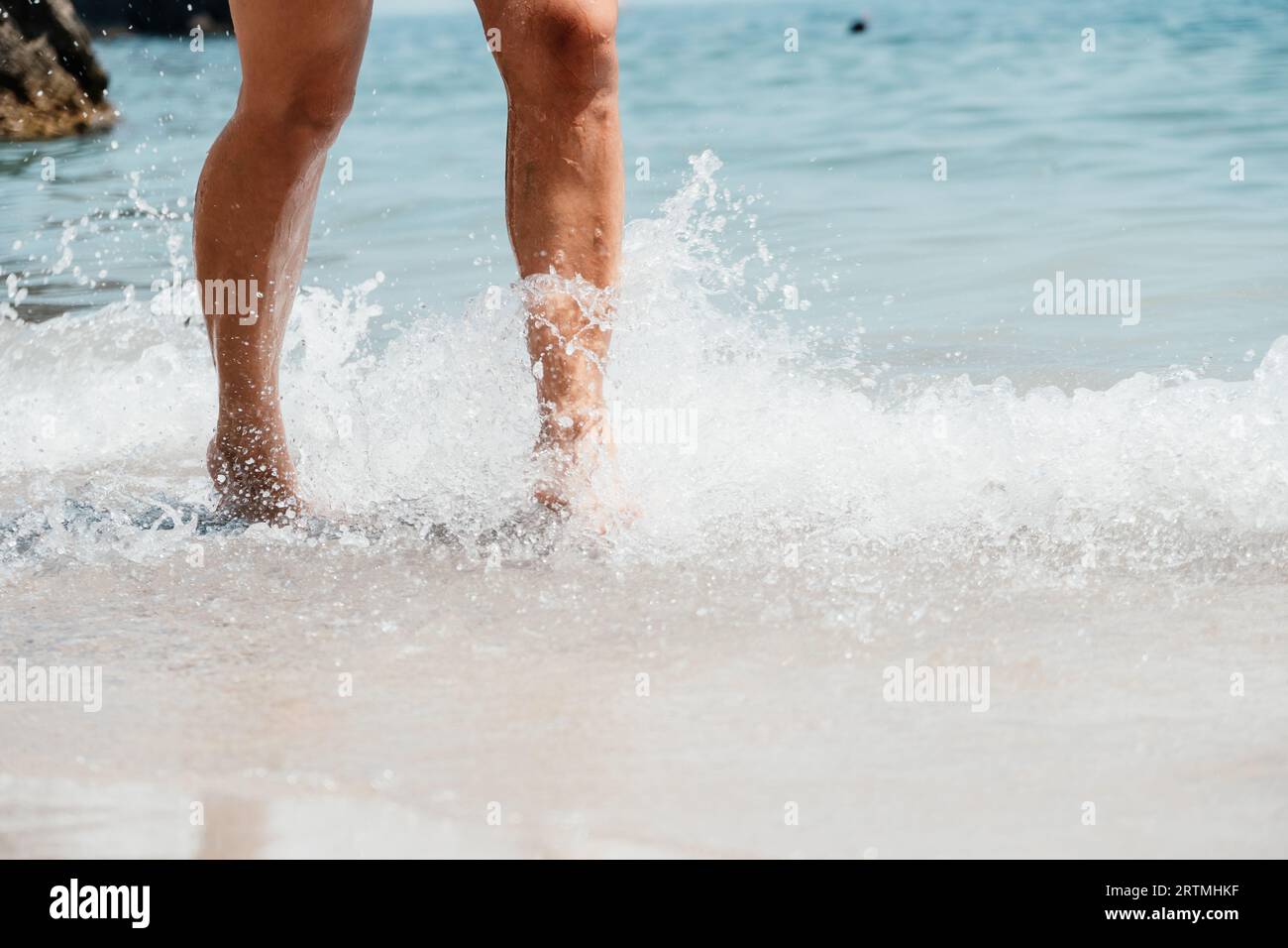 Sea beach travel - woman walking on sand beach leaving footprints in ...