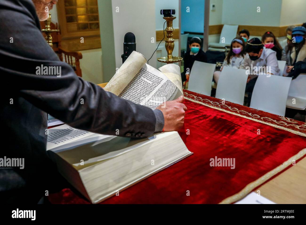 Purim celebration in Beth Yaacov synagogue, Paris, France. Rabbi Gabriel Farhi reading EstherÕs scroll Stock Photo