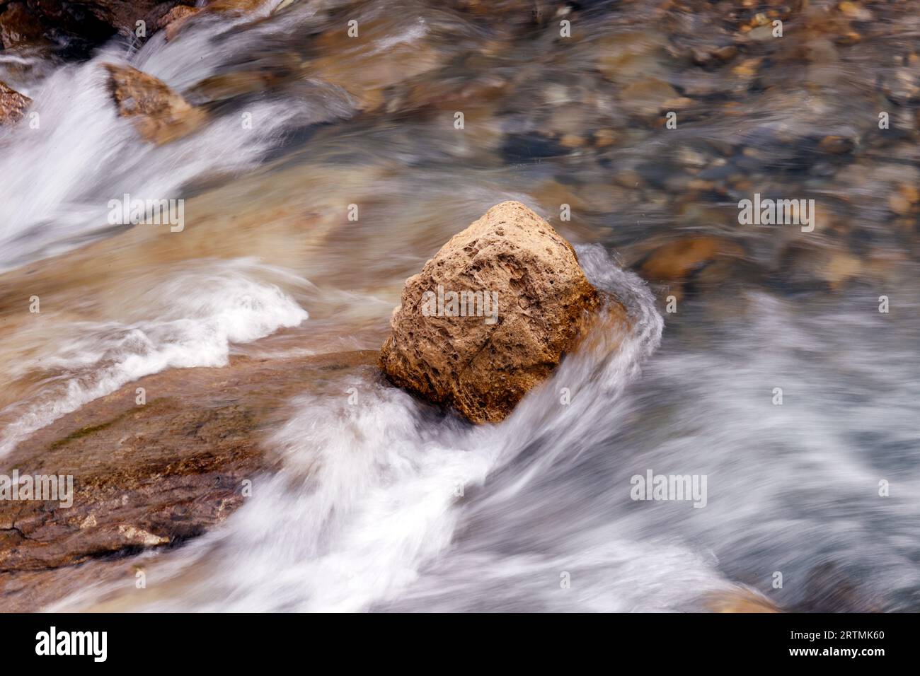 Mountain river flowing over rocks. River stony bottom. Cascade ...