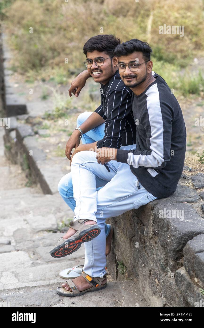 Young men sitting hi-res stock photography and images - Alamy