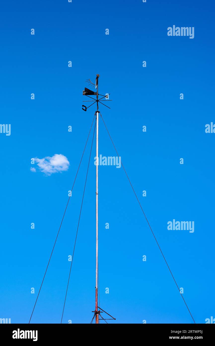 Windmill for weather forecasting on a background of blue sky Stock Photo