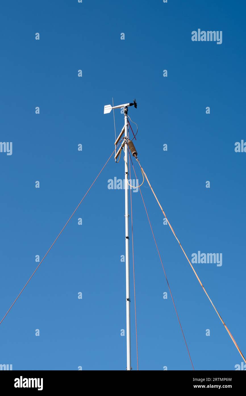 Windmill for weather forecasting on a background of blue sky Stock Photo