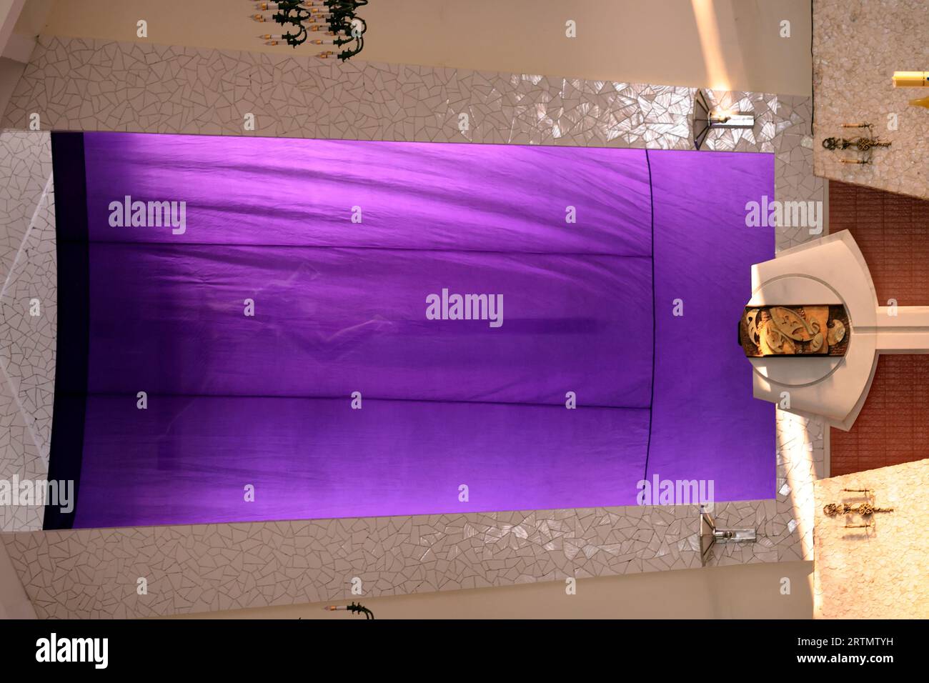 Lent and Holy Week. Sacred image covered with purple fabric. Religious