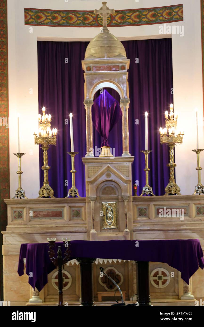 Catholic church. Lent and Holy Week. Sacred image covered with purple fabric. Religious symbol