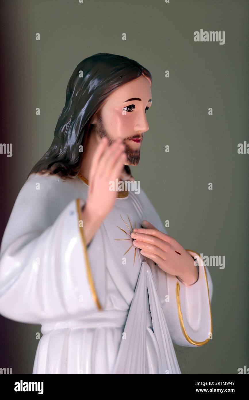 Jesus Christ.  His wounded hand points to the symbolic sacred heart.  Dong Nai. Vietnam. Stock Photo