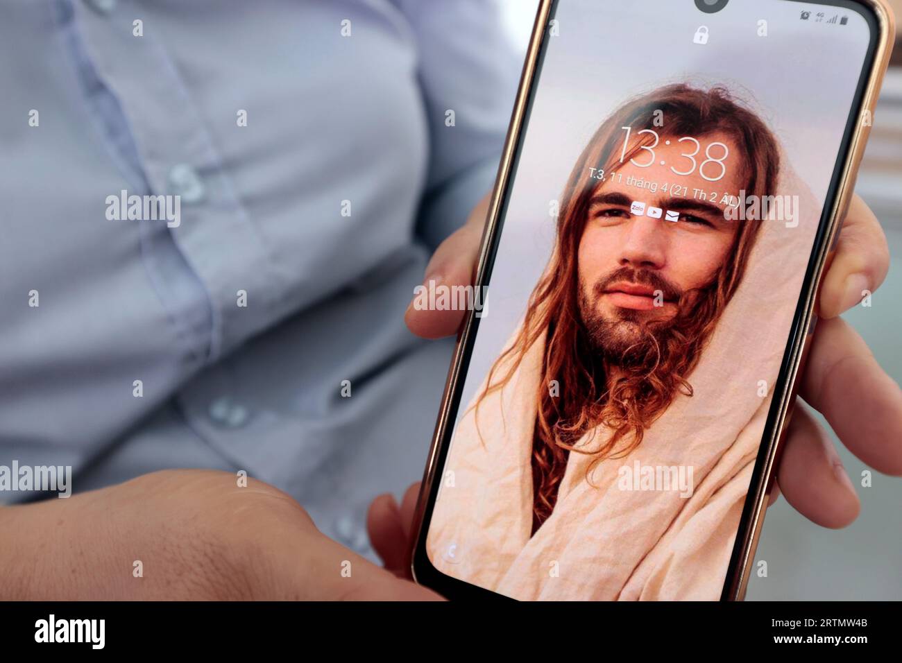 Smartphone with an image of Jesus Christ. Dong Nai. Vietnam. Stock Photo