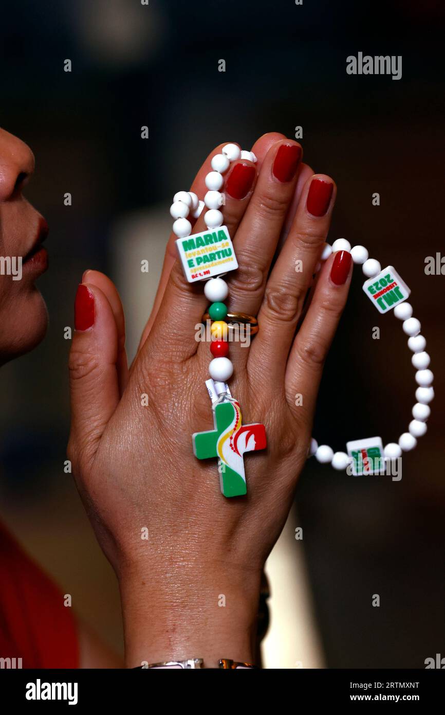 WYD World Youth Day 2023 Lisbon. Woman praying the Rosary. Portugal. Porto. Portugal Stock Photo