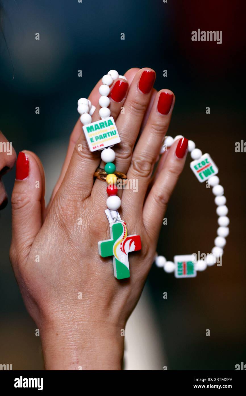 WYD World Youth Day 2023 Lisbon. Woman praying the Rosary. Portugal. Porto. Portugal Stock Photo