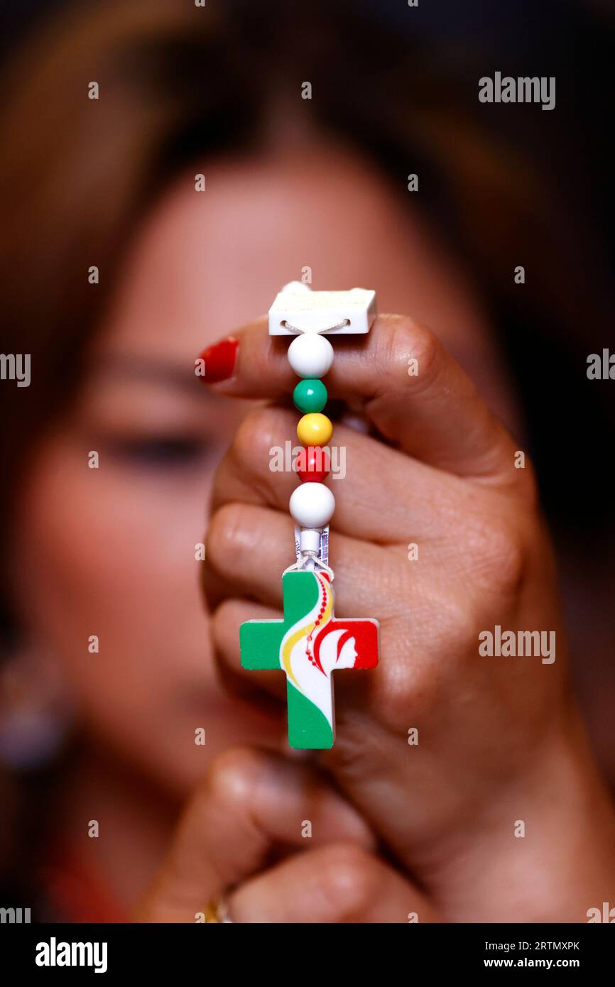 WYD World Youth Day 2023 Lisbon. Woman praying the Rosary. Portugal. Porto. Portugal Stock Photo