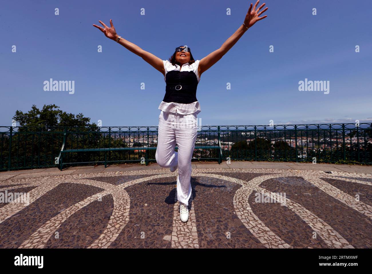 Happy  smiling woman jumping. Stock Photo