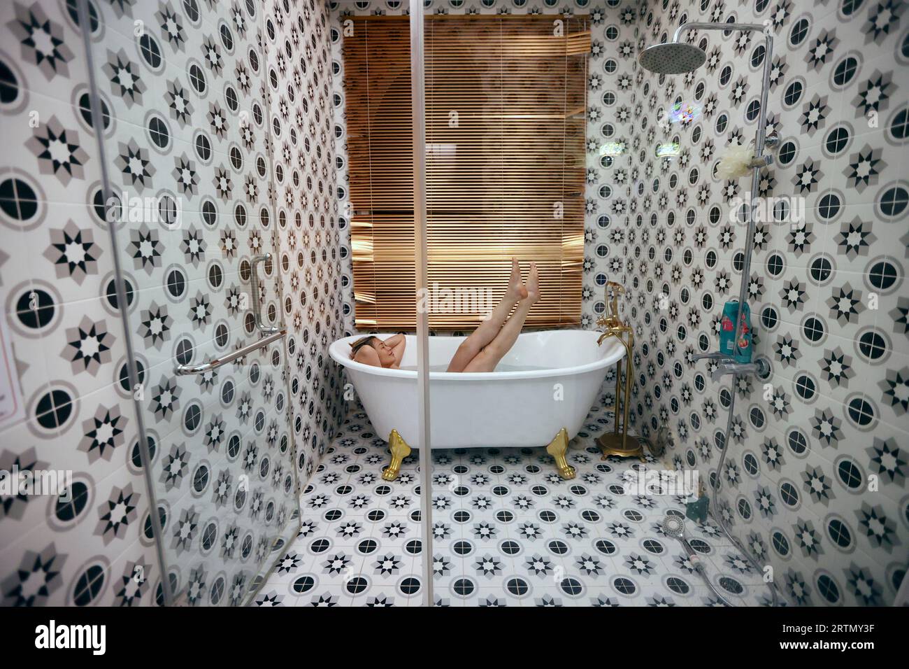 Woman traveler taking a bath in 5 star high quality hotel bathroom.  Health and beauty.  Vung Tau. Vietnam. Stock Photo