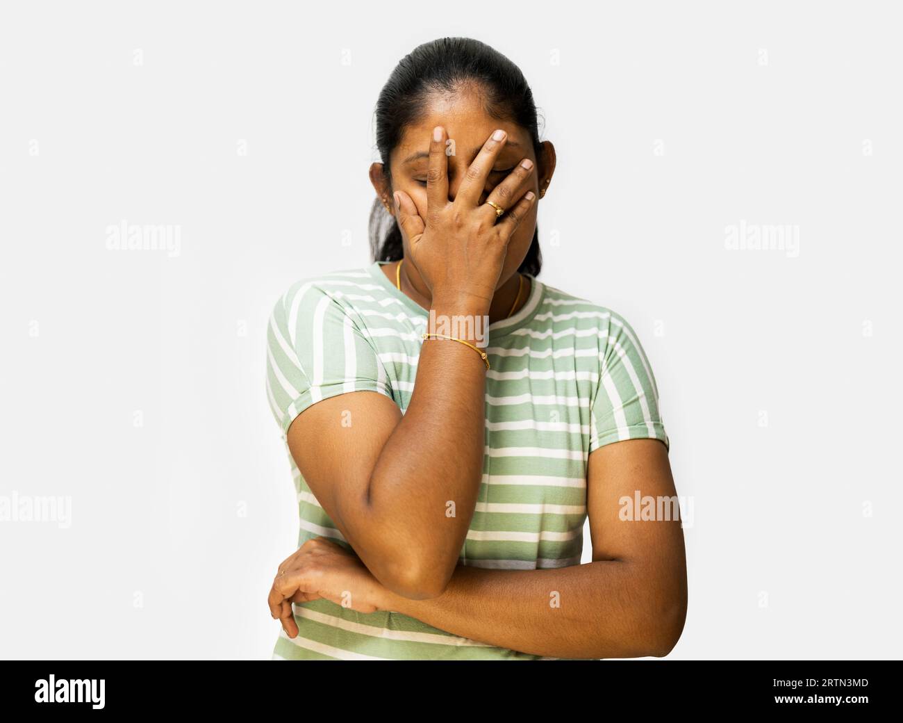 Scared, worry and face of Indian woman on pink background with