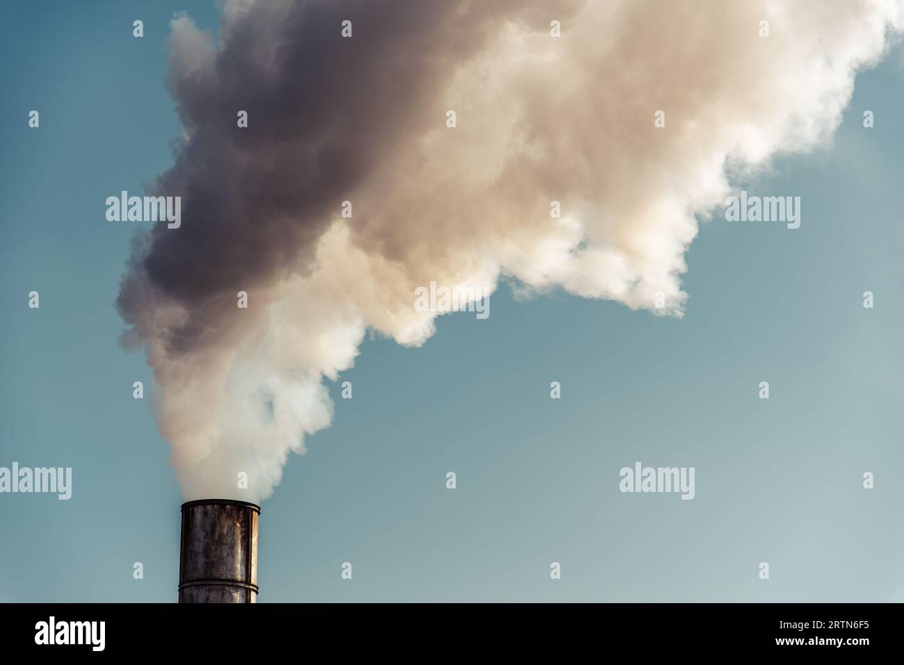The pipe of the factory polluting air. Environment concept. High quality photo Stock Photo