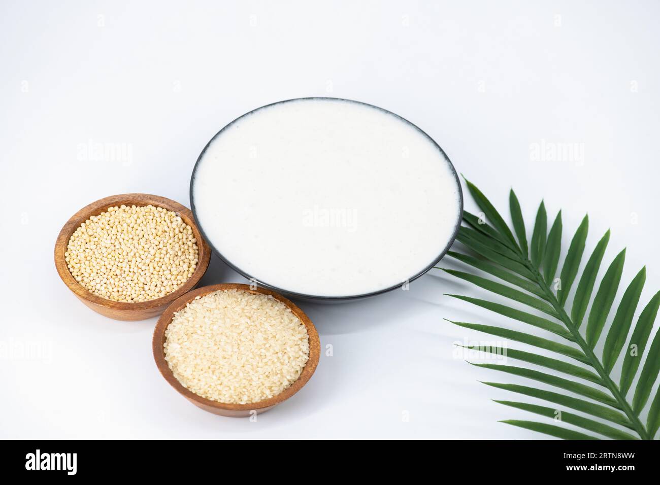 Selective focused image of fermented batter for idli and dosa in an isolated background. Idly and dosa batter in a bowl for fermentation, used to prep Stock Photo