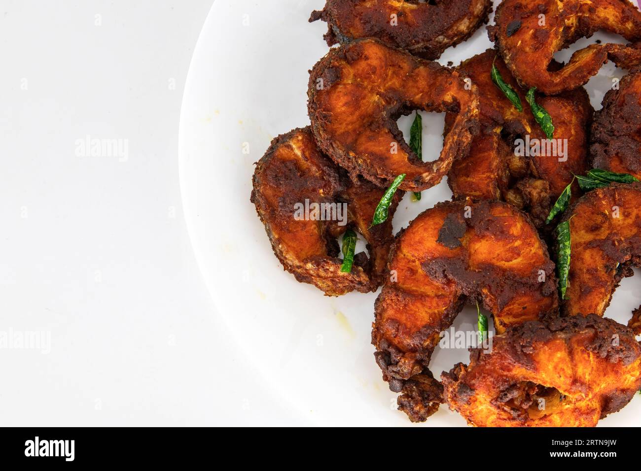 Cooking deep frying of crispy tasty fish sea food in plate with low oil