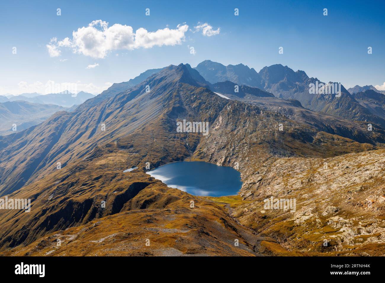 alpine lake of Lago Retico at the boarder of Ticino and Surselva, Switzerland Stock Photo