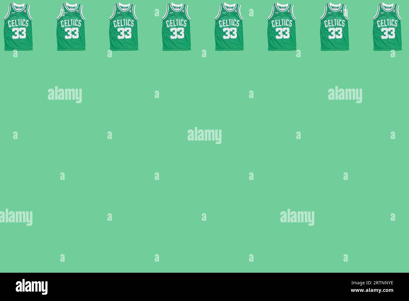 Boston Celtics retro green basketball jersey pattern featuring Larry Bird's number 33, on top, on green background. Basketball, spalding, sports equip Stock Photo