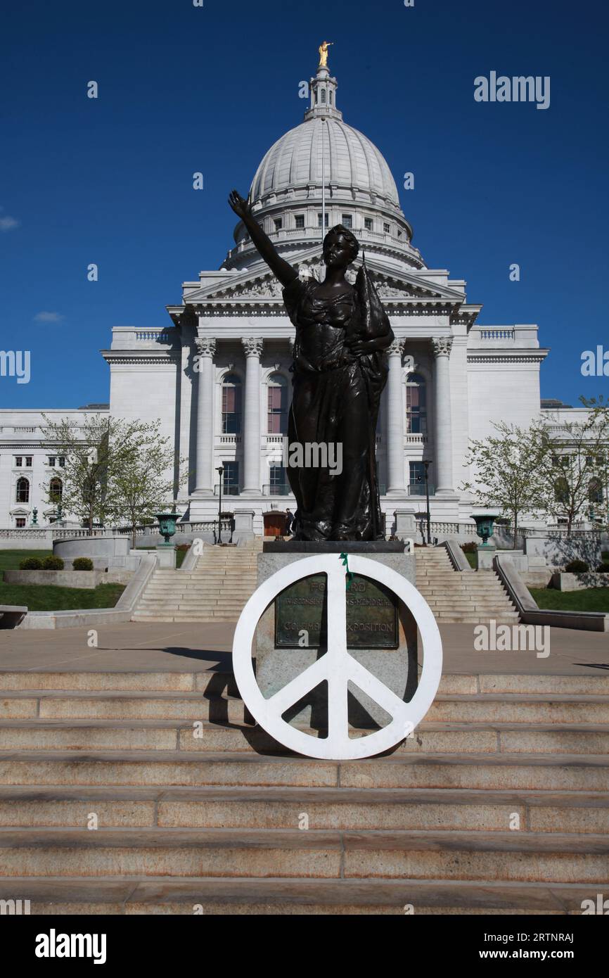 Peace sign leans on the statue 'Forward' by Jean Pond Miner Coburn at the State Capitol Building at Madison Wisconsin WI Stock Photo