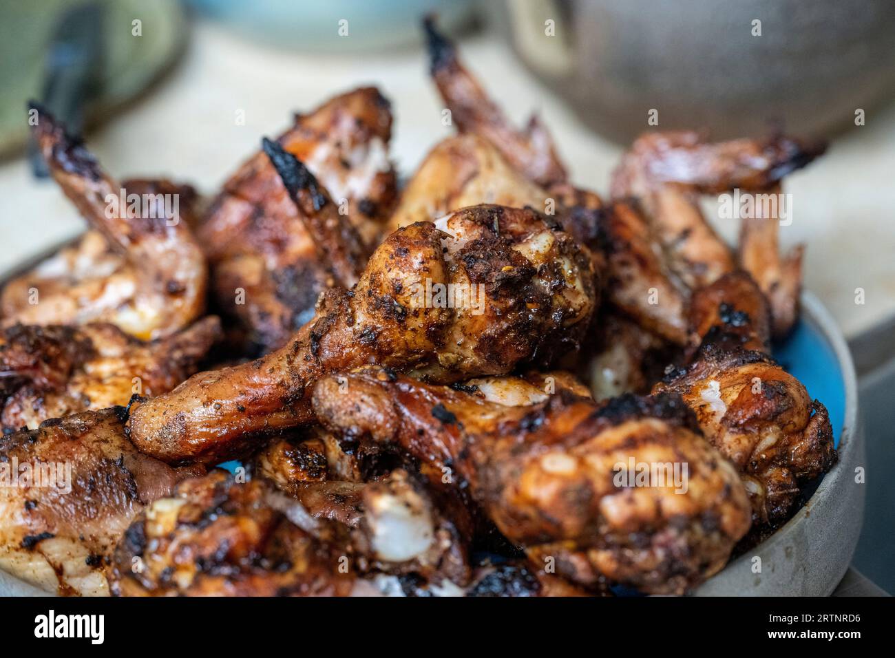 Outdoor cooking. Chicken wings and drumsticks grilled on a BBQ gas