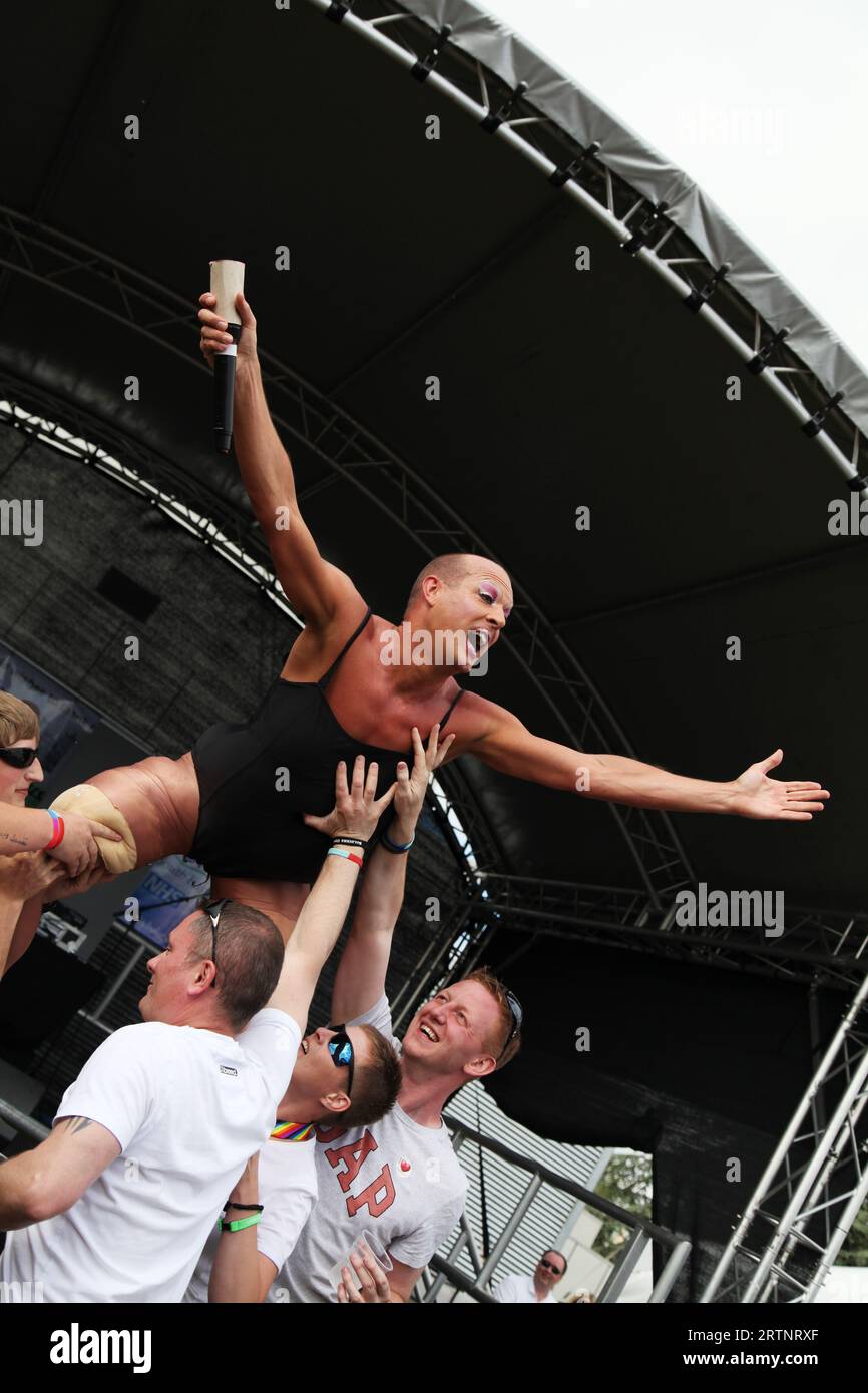 Trans man stage dives at Oxford Pride event June 2013 Stock Photo