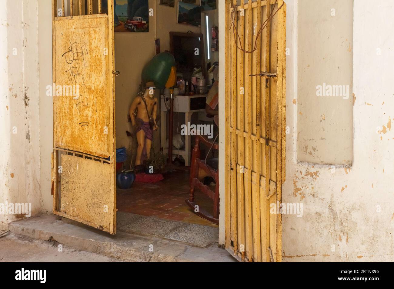 Havana, Cuba - August 30, 2023: Open door of a garage where a small business is set up. Stock Photo