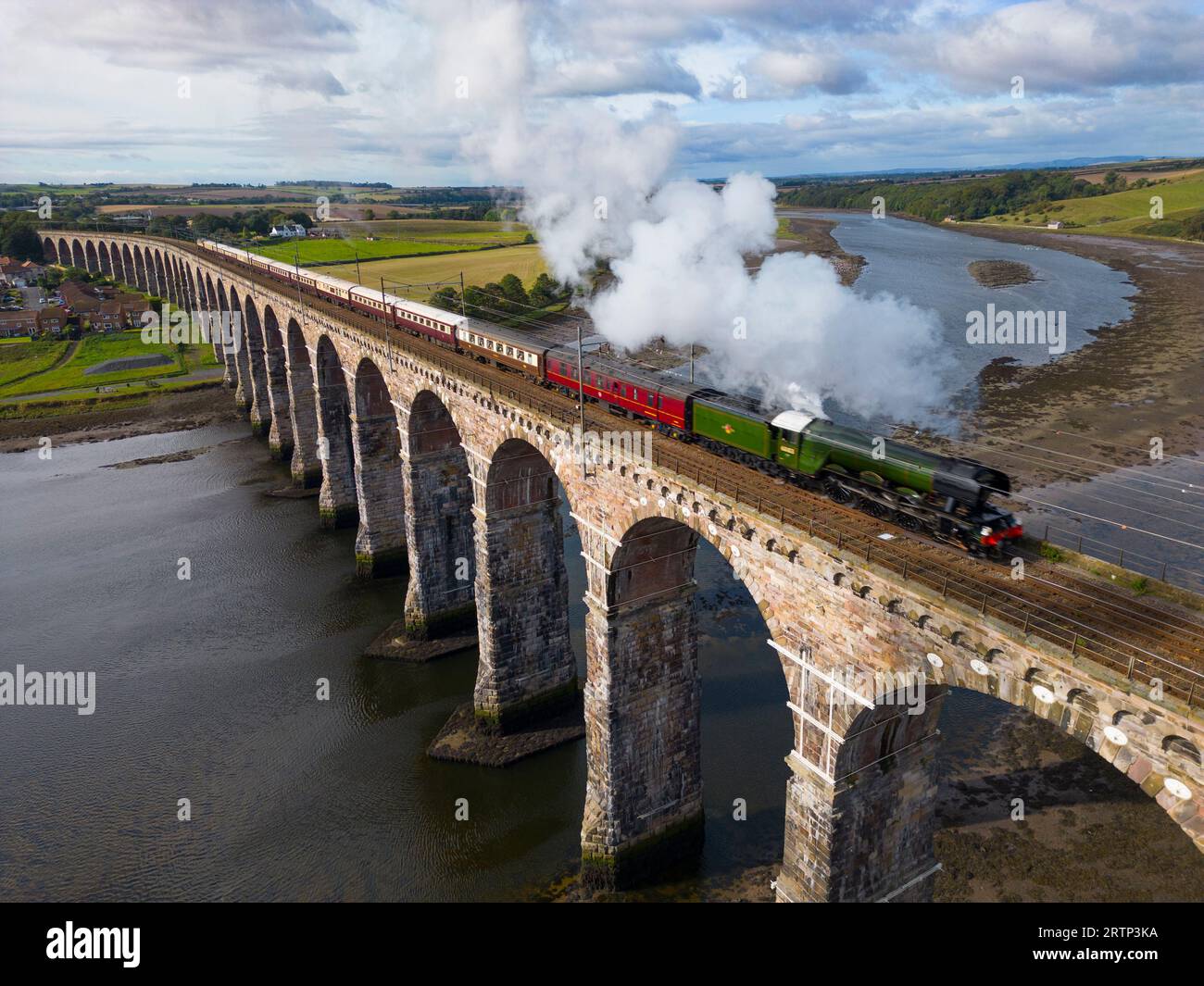 The Flying Scotsman steam train crosses the Royal Border Bridge across the River Tweed at Berwick upon Tweed , England during centenary excursion. Stock Photo
