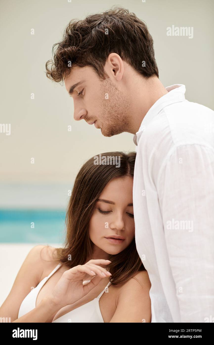 couple bonding and trust, beautiful woman leaning on handsome man, romantic getaway concept Stock Photo