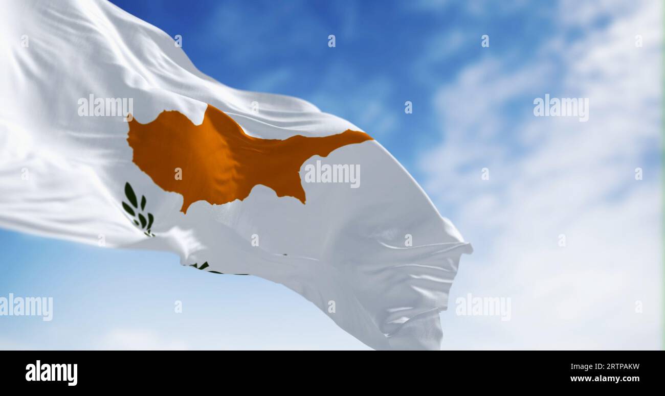 Cyprus national flag waving on a clear day. White flag with two olive branches under the dark orange map of the whole island. 3d illustration render. Stock Photo