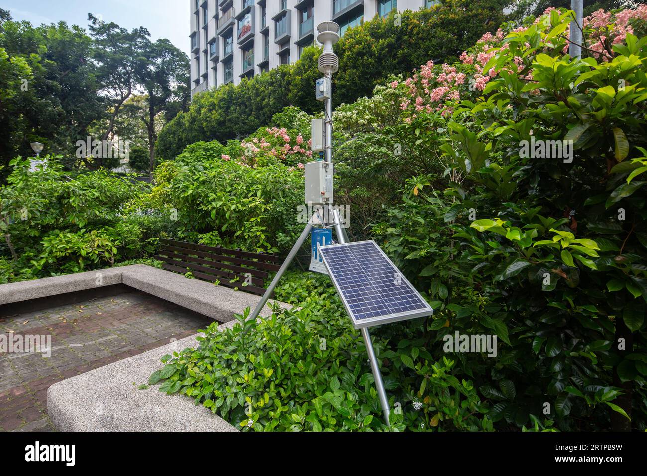 A weather station placed outside a public park space to measure air ...