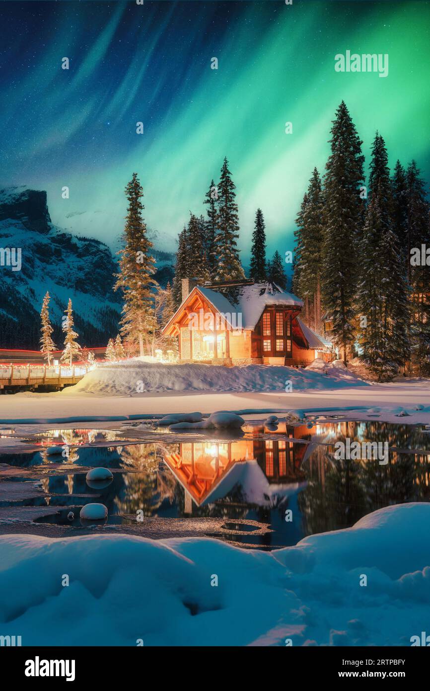 Aurora over cabin at white mountain recreation area in winter; alaska  united states of america Stock Photo - Alamy, image size:866x1390