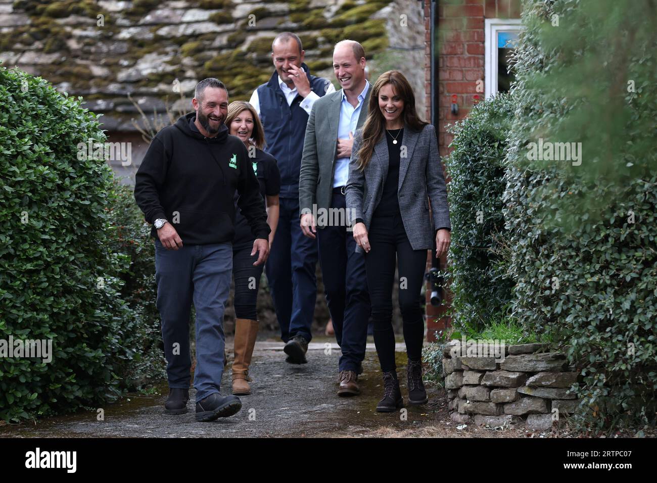 The Prince and Princess of Wales talk to Sam Stables (left) and Emily