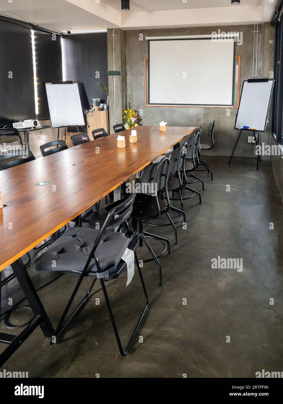 The empty meeting room for co-working space in the small business building, font view with the copy space. Stock Photo