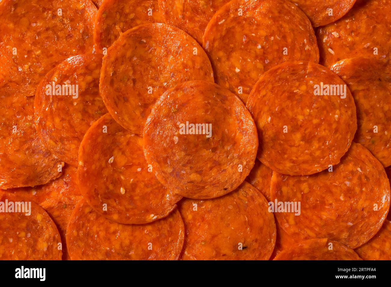 Organic Uncured Pepperoni Slices in a Pile Stock Photo