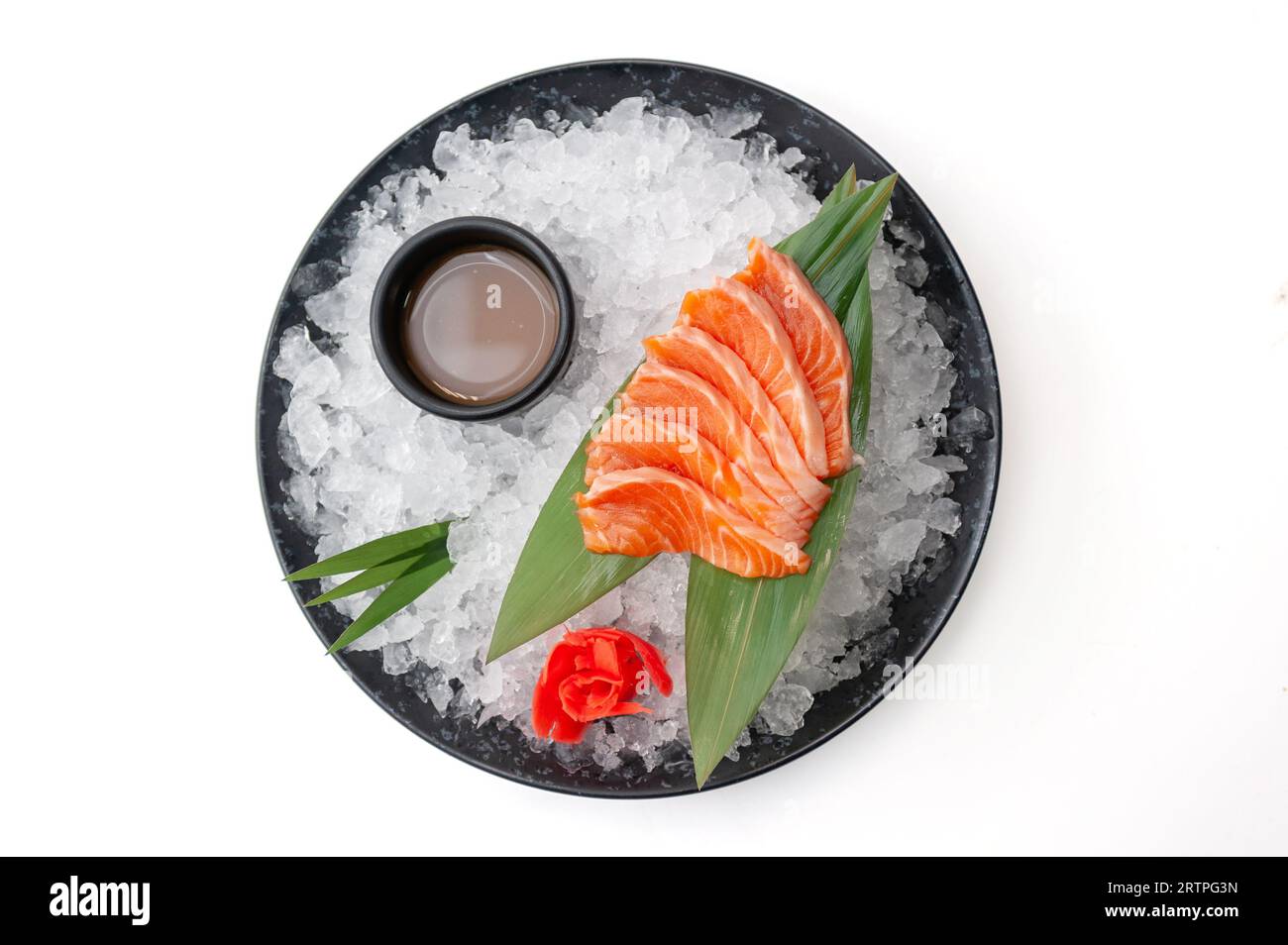 Salmon sashimi plate with sauce on ice isolated Stock Photo